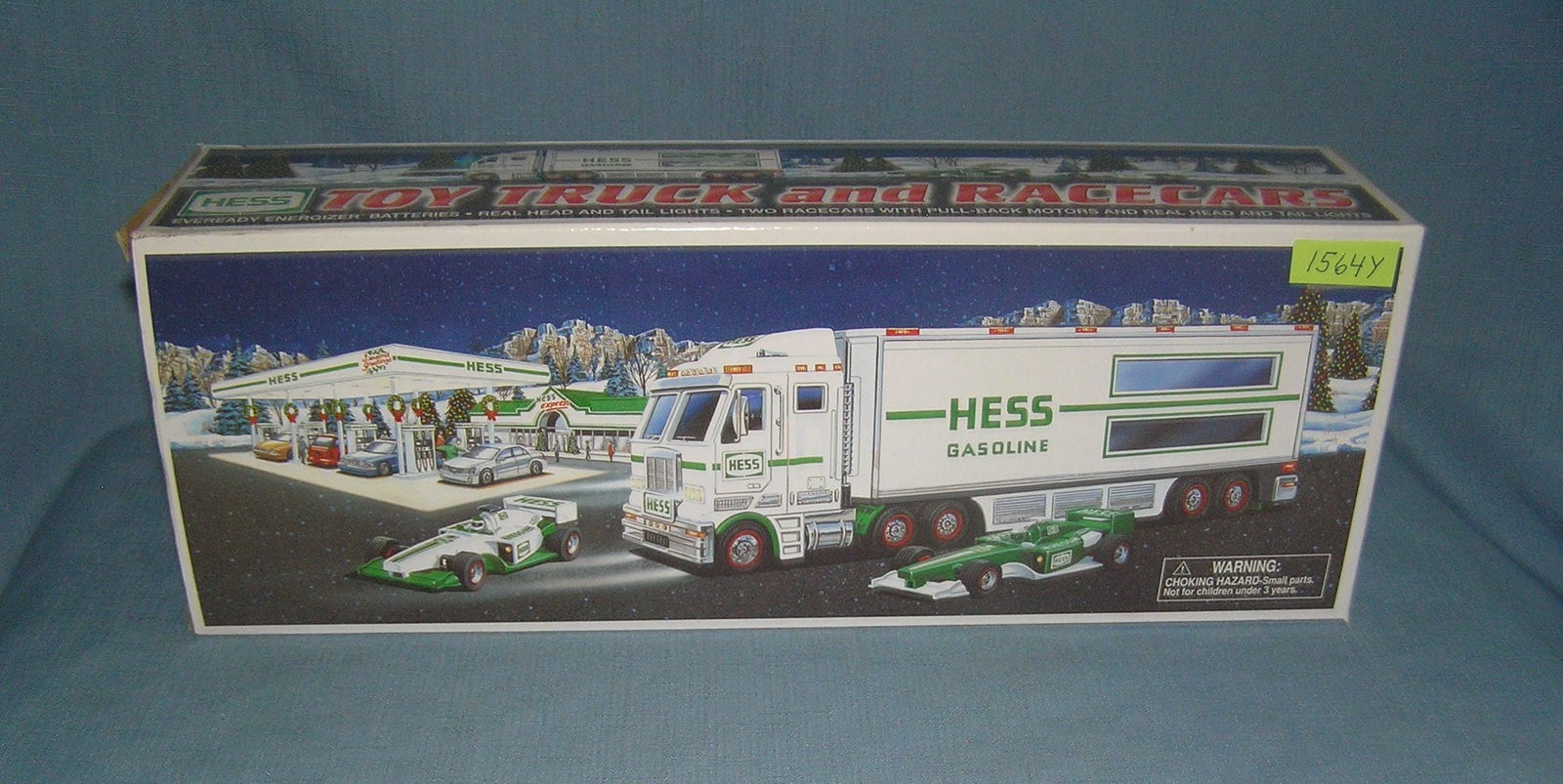 Hess toy trucks and race cars with original box: Hess toy trucks and race cars with original box est. value $50.00-$60.00