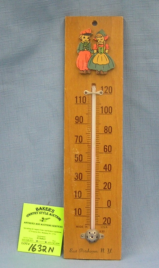 Early Dutch themed wooden wall thermometer: Early Dutch themed character decorated wooden wall mount thermometer, American made with East Patchogue NY advertising on base circa 1950's est. value $30.00-$40.00