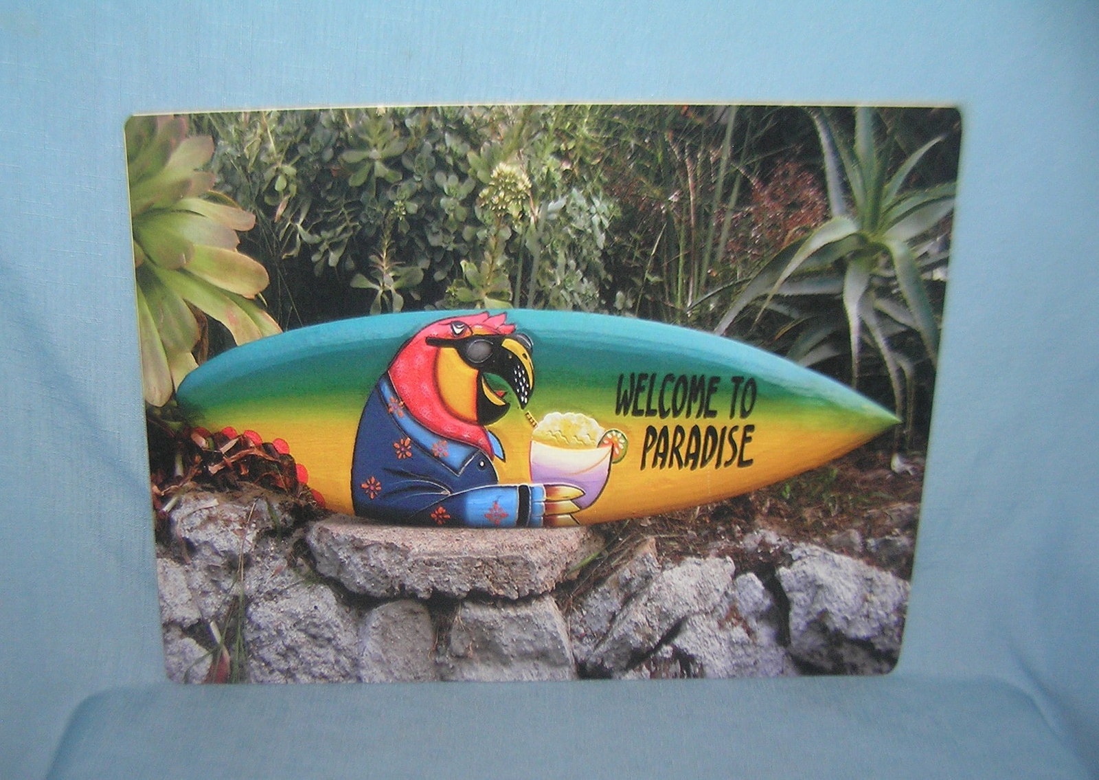 Welcome to Paradise Jimmy Buffet retro style sign: Welcome to Paradise Jimmy Buffet type retro style advertising sign printed on PVC hard board these signs are auctioned for there decorative and display purposes 12 by 16 est. value $50.00-$60.00