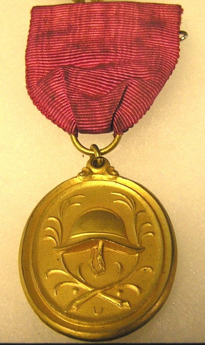 WWII Nazi Germany gold badge and ribbon: Vintage WWII Nazi Germany gold badge and ribbon est. value $125.00-$150.00