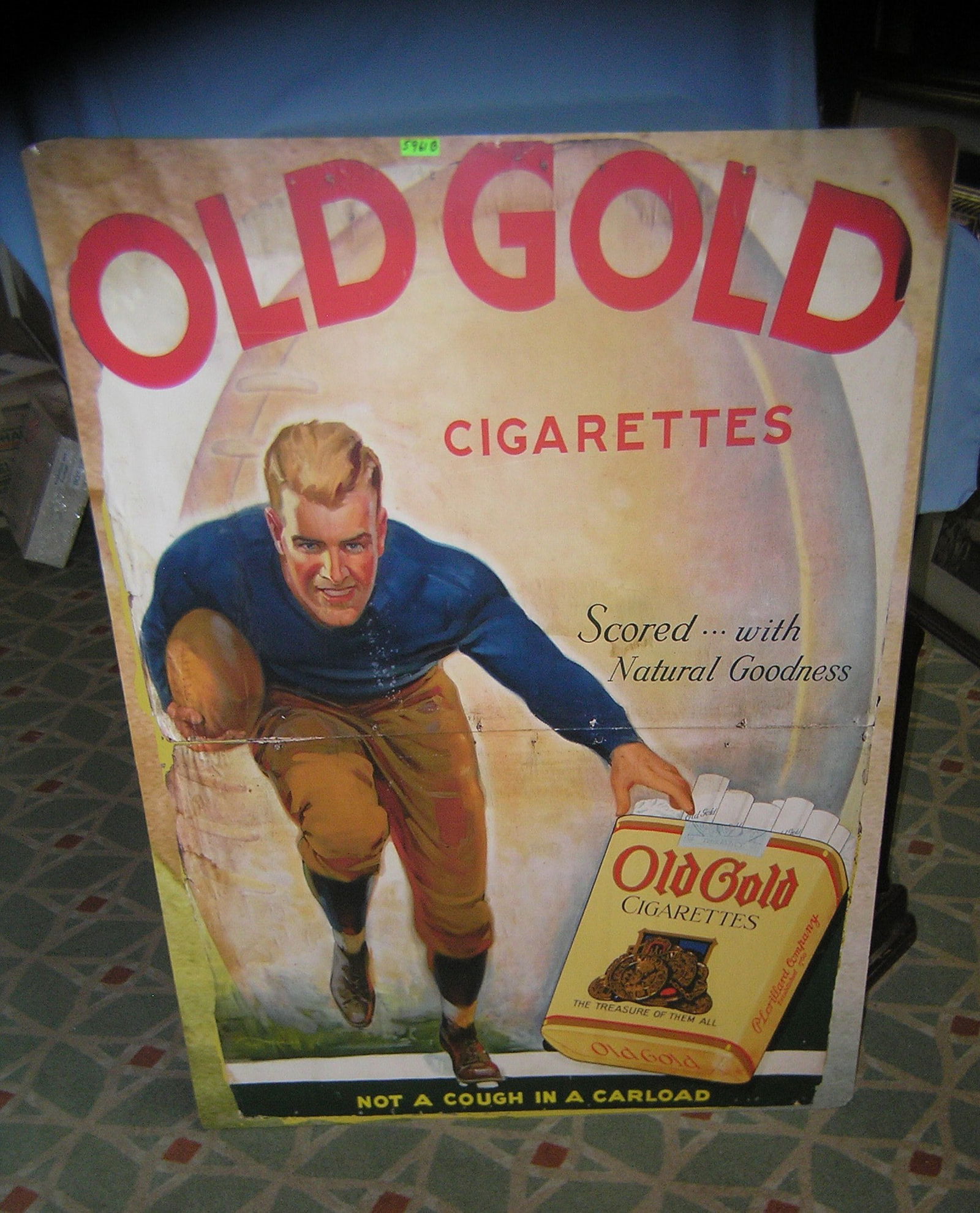 Old Gold cigarettes large retro style advertising sign: Old Gold cigarettes football themed large retro style advertising sign mounted on masonite est. value $750.00-$800.00