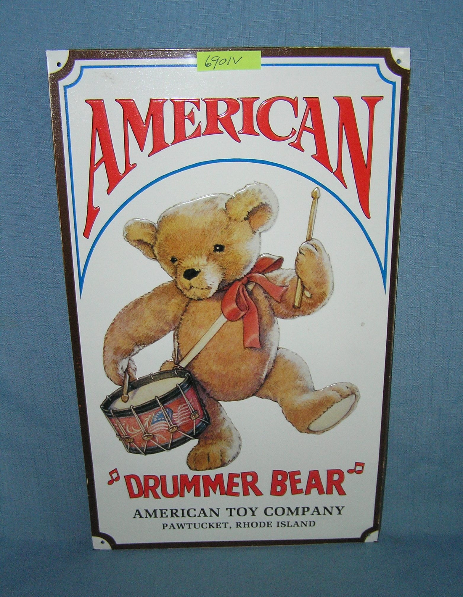 American Drummer bear teddy bear by the American Toy Company tin advertising sign: American Drummer bear teddy bear by the American Toy Company tin advertising sign 9 3/4 inches by 16 1/4 inches est. value $80.00-$100.00