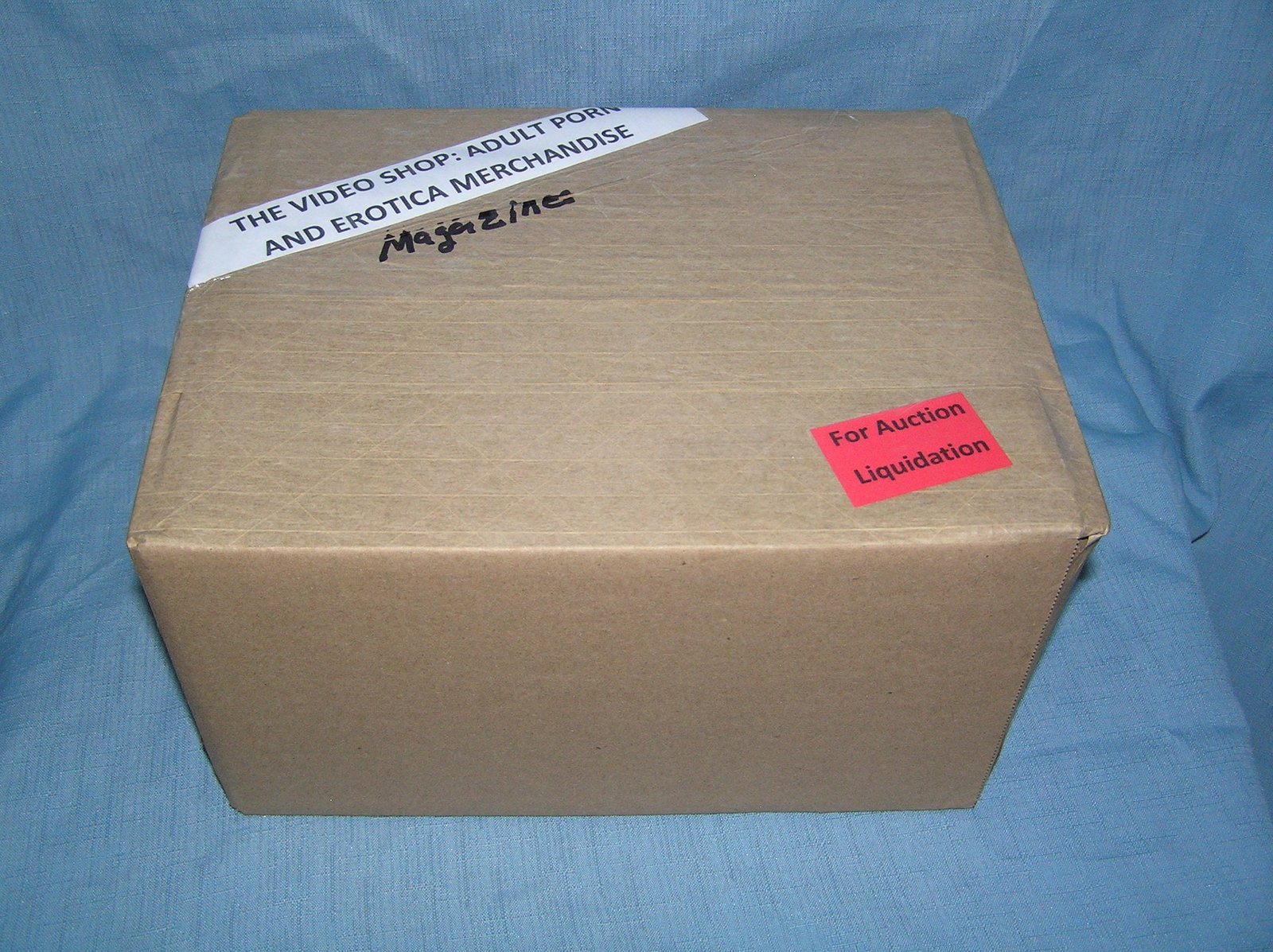 Moving and Storage Company mystery box lot marked The Video Shop: Moving and Storage Company mystery box lot marked The Video Shop: Adult Porn and Erotica Magazines part of a moving and storage company seized or unclaimed merchandise group sent to auction for liquid