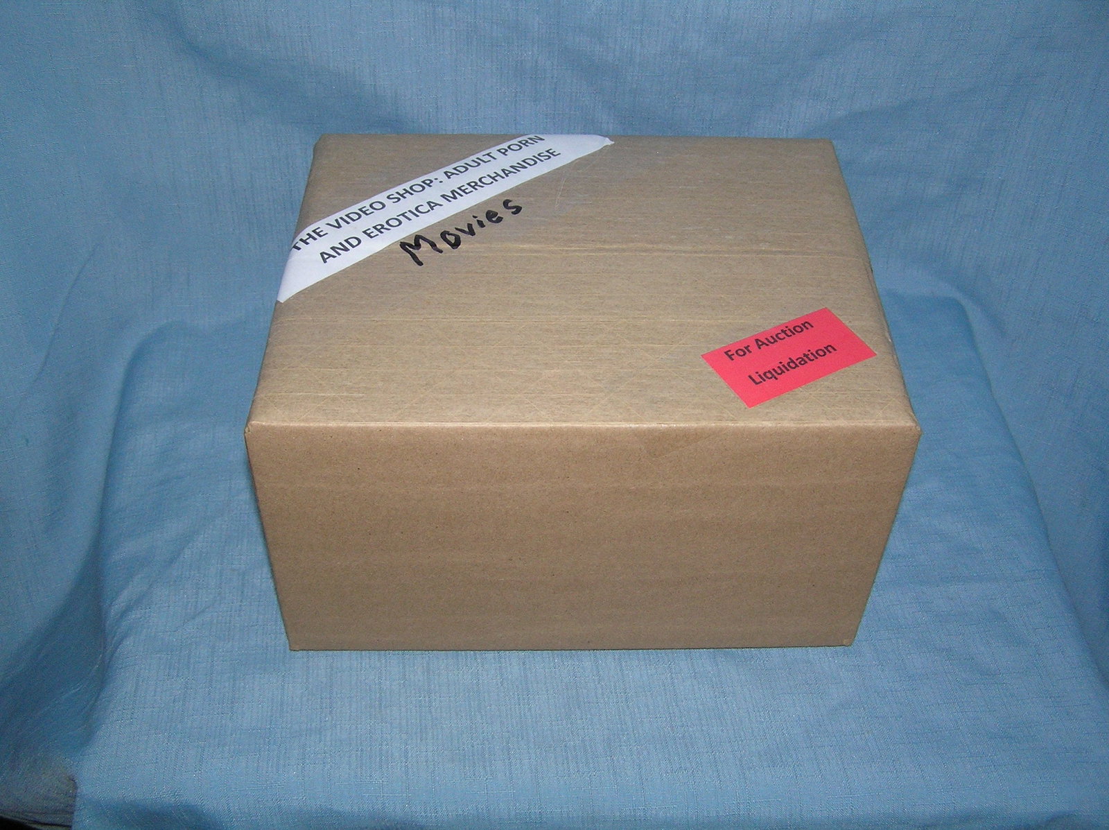Moving and Storage Company mystery box lot marked The Video Shop: Moving and Storage Company mystery box lot marked The Video Shop: Adult Porn and Erotica Movies part of a moving and storage company seized or unclaimed merchandise group sent to auction for liquidati