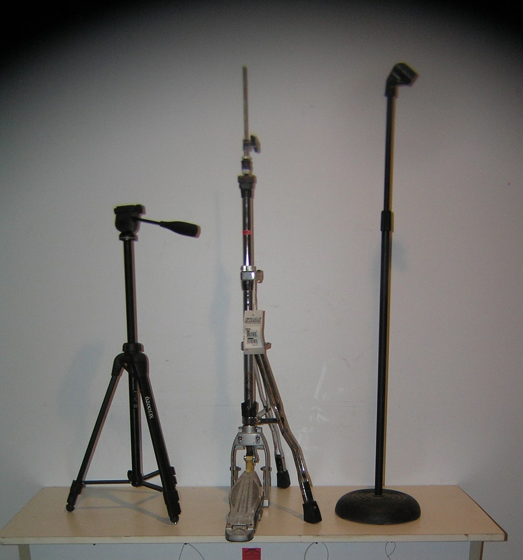 Group of music and photography stands: Group of music and photography stands includes Tama, drum foot pedal stand kit, telescoping microphone stand and a like new photographer's camera tripod est. value $150.00-$175.00