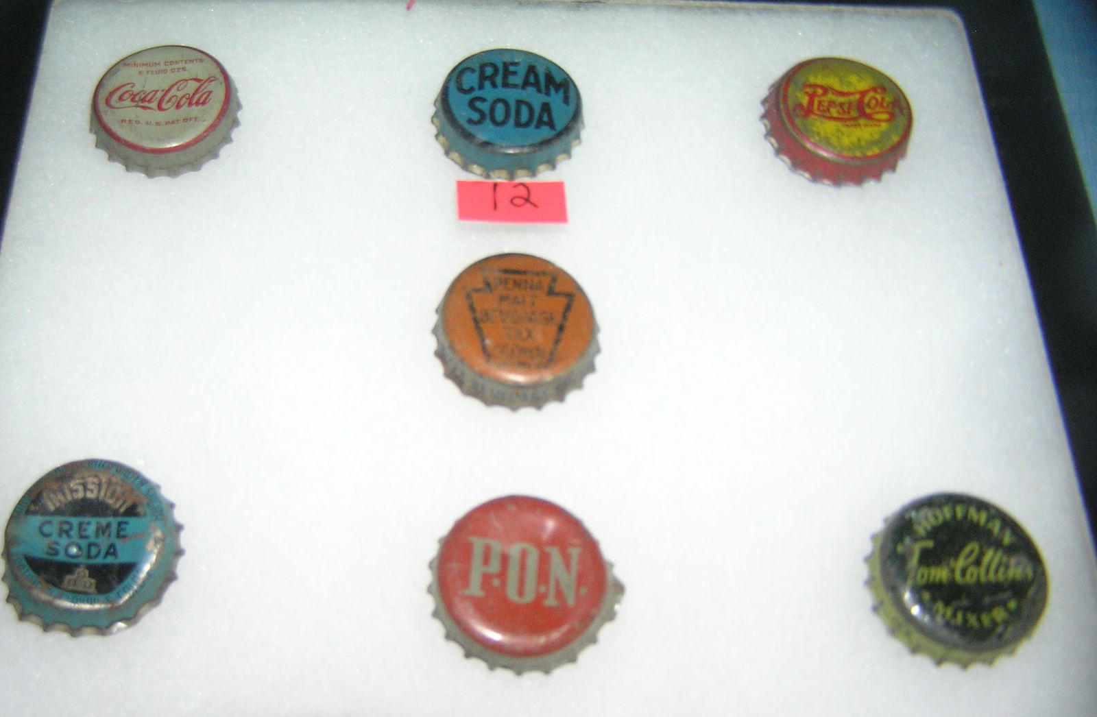 Group of antique soda caps: Group of antique soda caps includes Coca Cola, Pepsi cola, cream soda Mission, Hoffman, Penna Malt beverages and P.O.N. est. value $50.00-$60.00