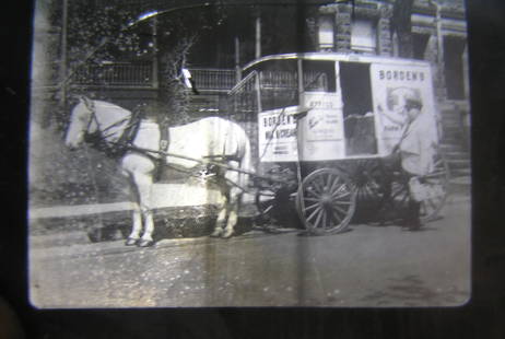Borden Milk horse drawn wagon glass slide: Rare Borden milk and dairy horse drawn delivery wagon original glass magic lantern slide circa 1880?s small scratch like crack to glass otherwise very good this slide is extremely rare $275.00-$325.00