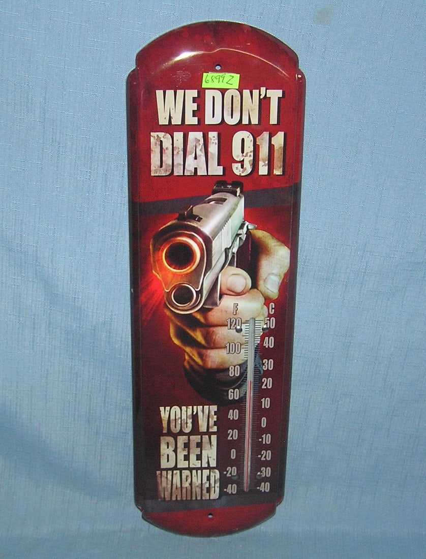 We don't dial 911 metal thermometer sign: We don't dial 911 metal thermometer sign est. value $40.00-$50.00