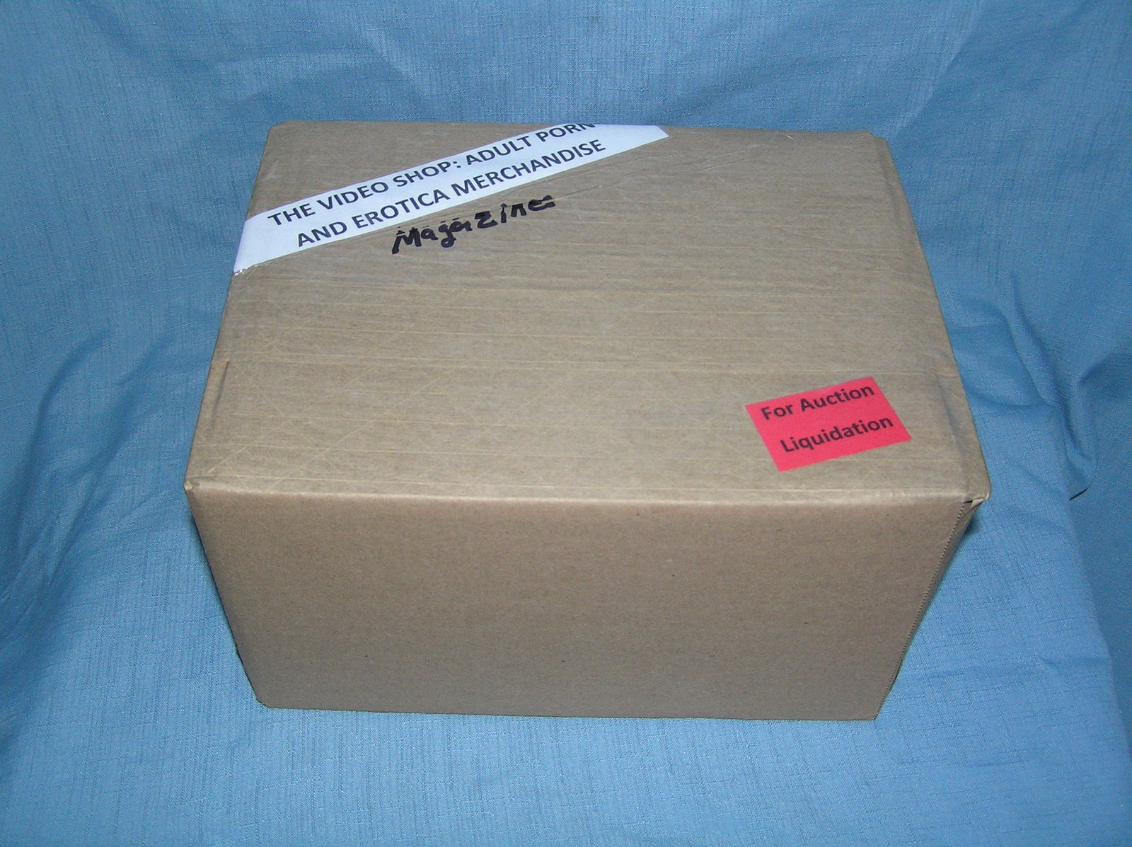 Moving and Storage Company mystery box lot marked The Video Shop: Moving and Storage Company mystery box lot marked The Video Shop: Adult Porn and Erotica Magazines part of a moving and storage company seized or unclaimed merchandise group sent to auction for liquid