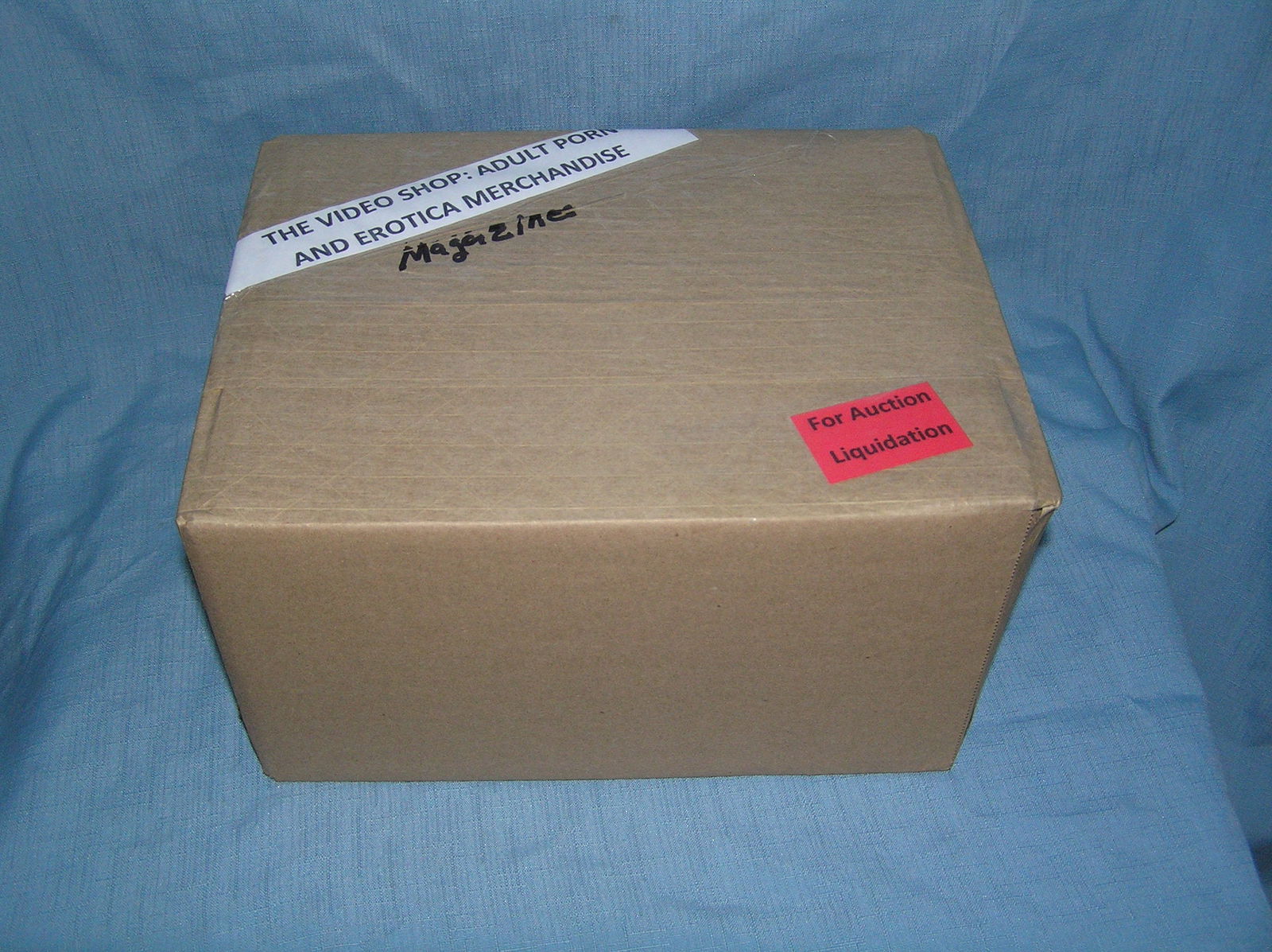 Moving and Storage Company mystery box lot marked The Video Shop: Moving and Storage Company mystery box lot marked The Video Shop: Adult Porn and Erotica Magazines part of a moving and storage company seized or unclaimed merchandise group sent to auction for liquid