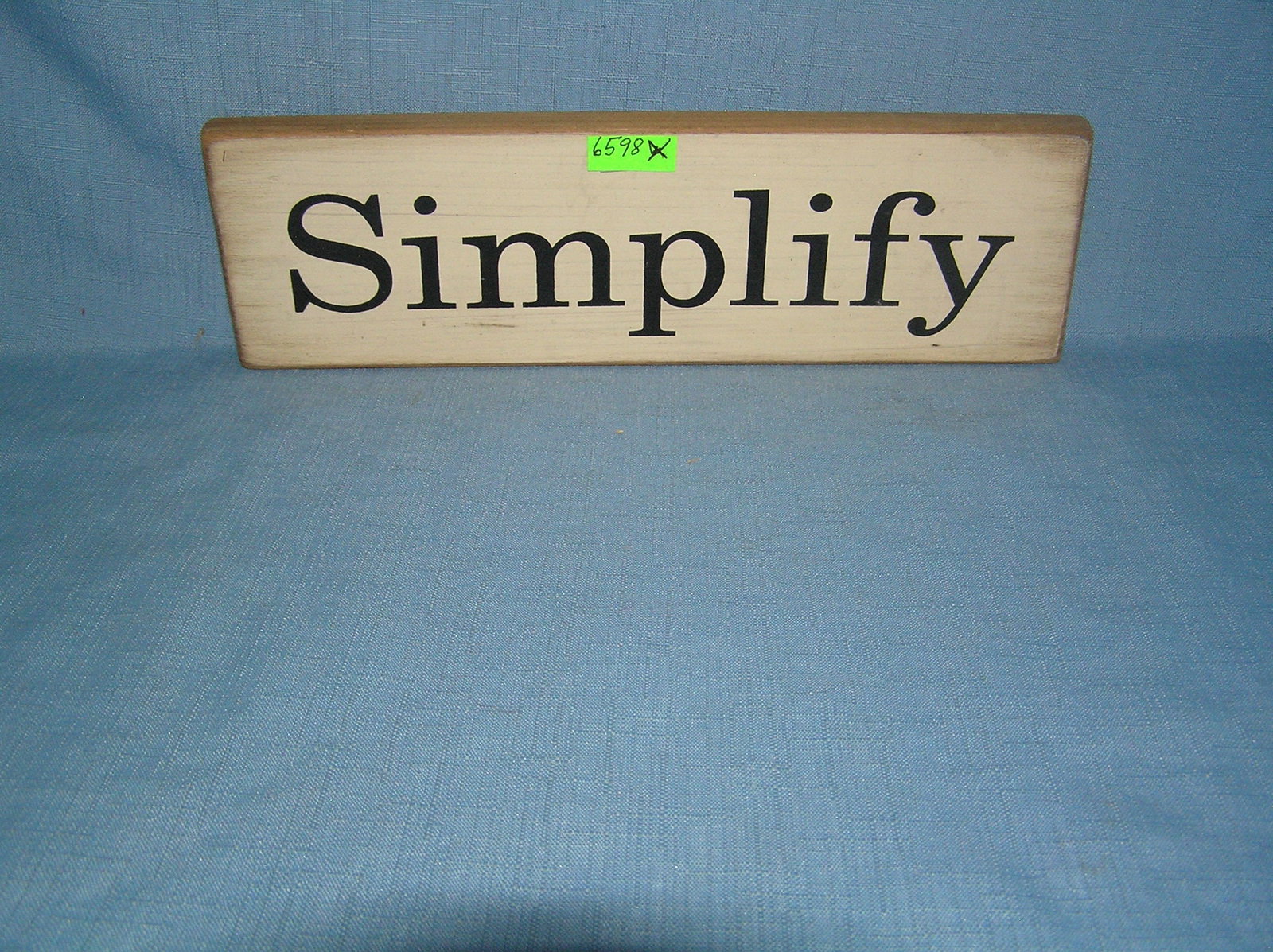 Simplify wood sign: Simplify wood sign est. value $25.00-$30.00