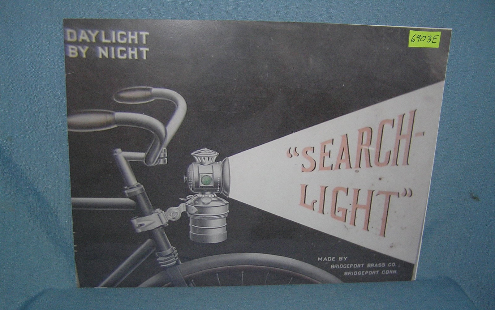 search light bicycle lantern retro retro style advertising sign: search light bicycle lantern retro retro style advertising sign printed on PVC hardboard these signs are auctioned for their decorative and display purposes 12 inches by 16 inches est. value $50.00-$6
