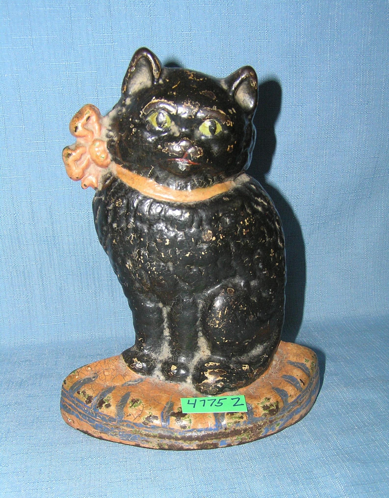 Cast iron seated cat door stop circa 1930s: Cast iron seated cat door stop circa 1930s est. value $350.00-$375.00