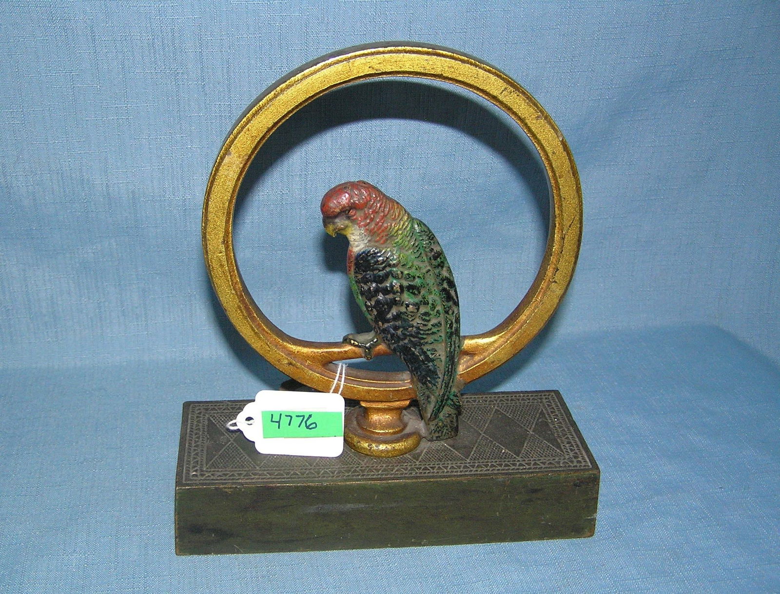 Hand painted cast iron parrot seated in ring door stop circa 1930s: Hand painted cast iron parrot seated in ring door stop circa 1930s est. value $400.00-$45.000