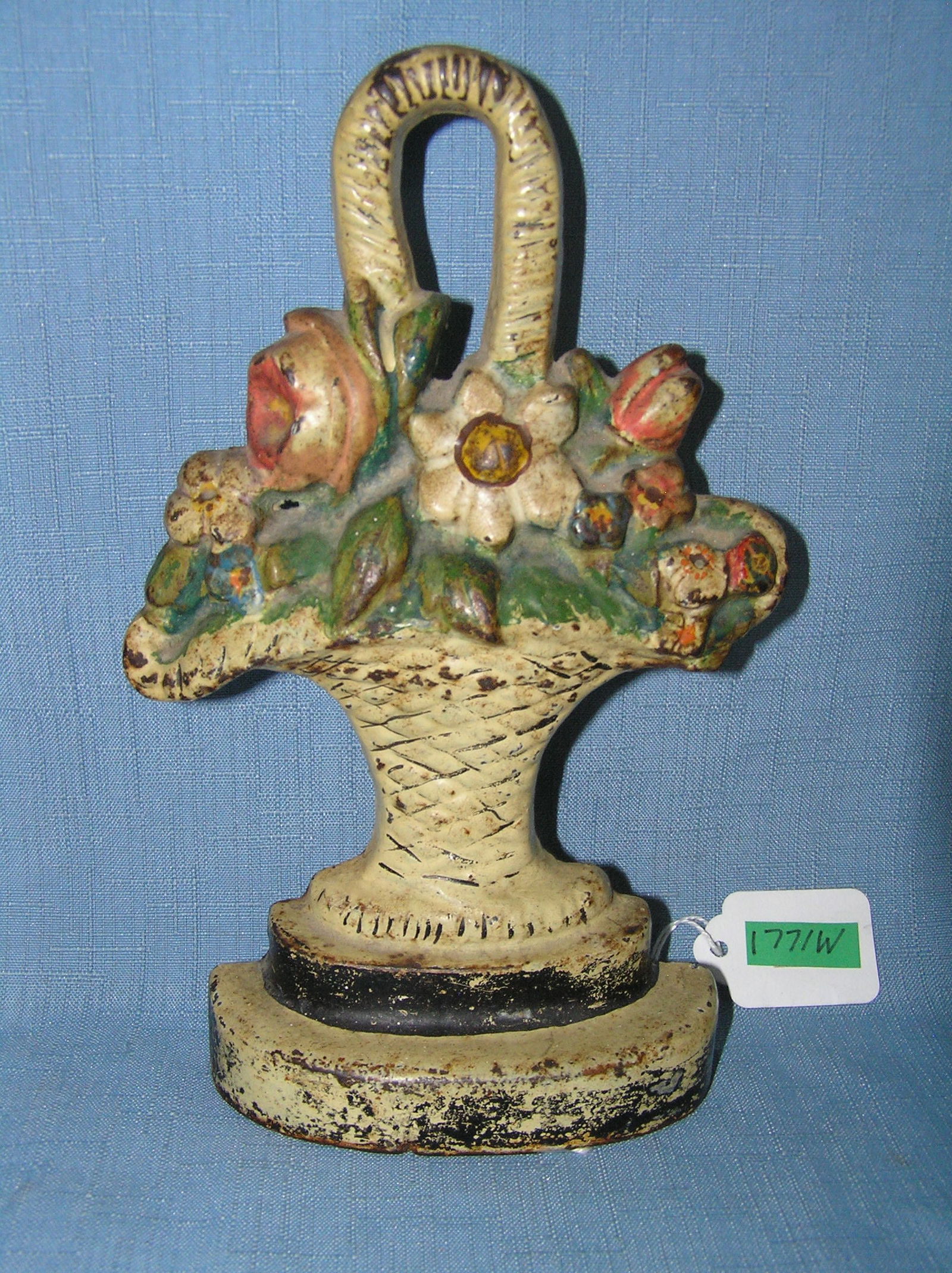 Floral boquet door stop: Floral boquet door stop all hand painted and cast iron circa early 1900s est. value $350.00-$450.00