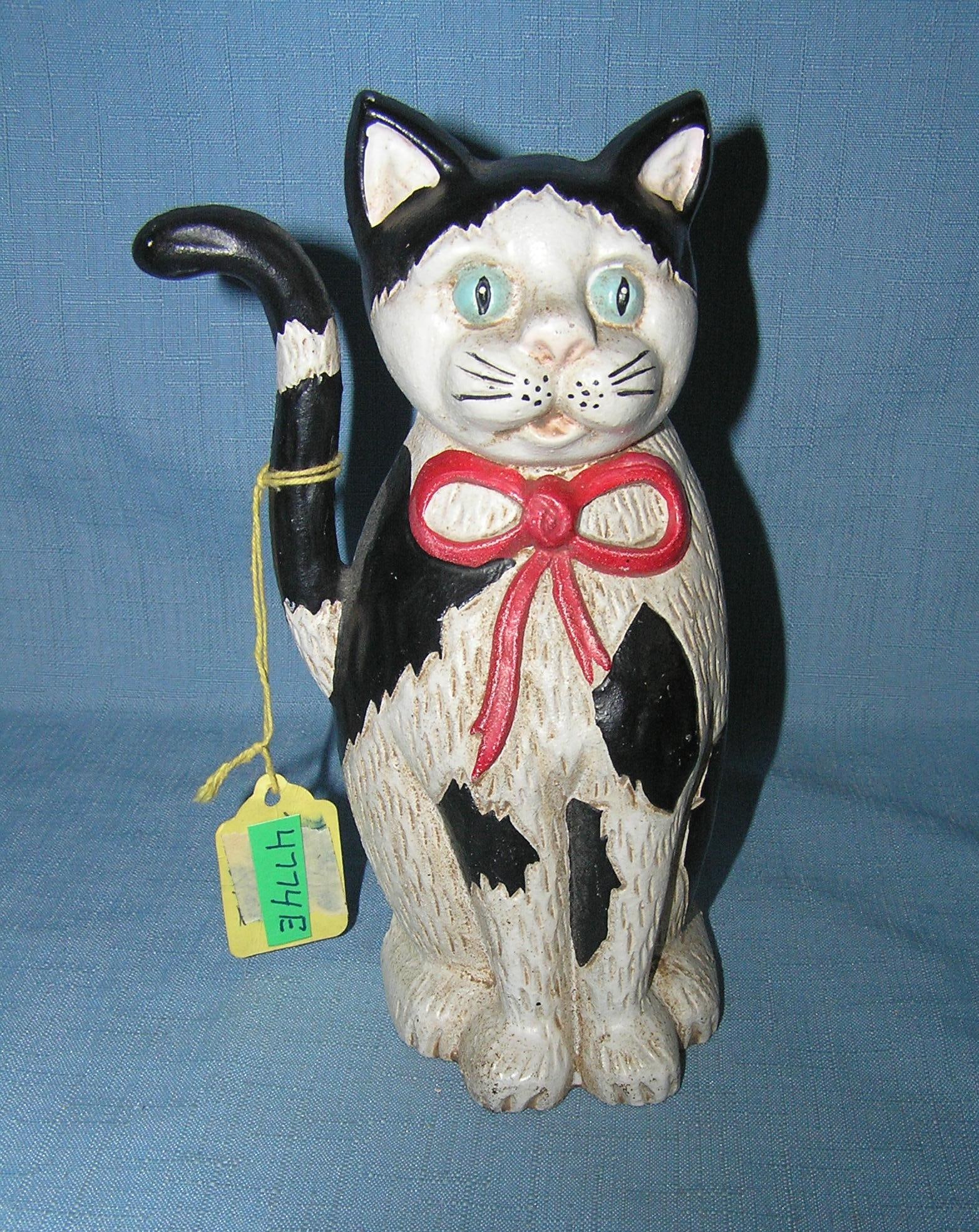 Painted cast iron cat door stop: Painted cast iron cat door stop est. value $65.00-$75.00