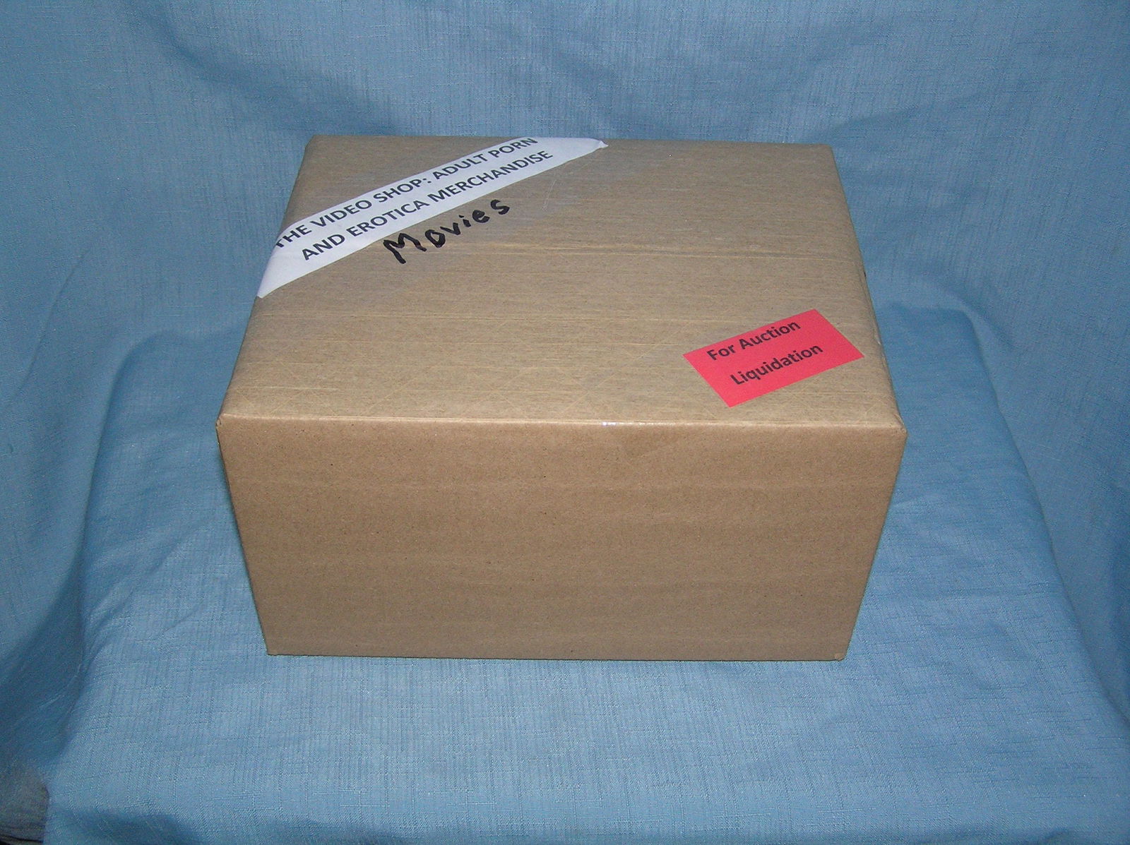 Moving and Storage Company mystery box lot marked The Video Shop: Moving and Storage Company mystery box lot marked The Video Shop: Adult Porn and Erotica Movies part of a moving and storage company seized or unclaimed merchandise group sent to auction for liquidati