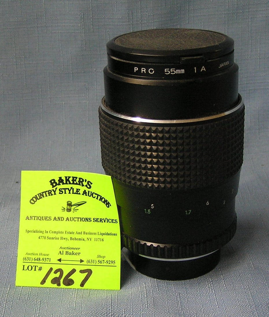 Vintage zoom lens: Vintage 55mm zoom lens est. value $50.00-$65.00