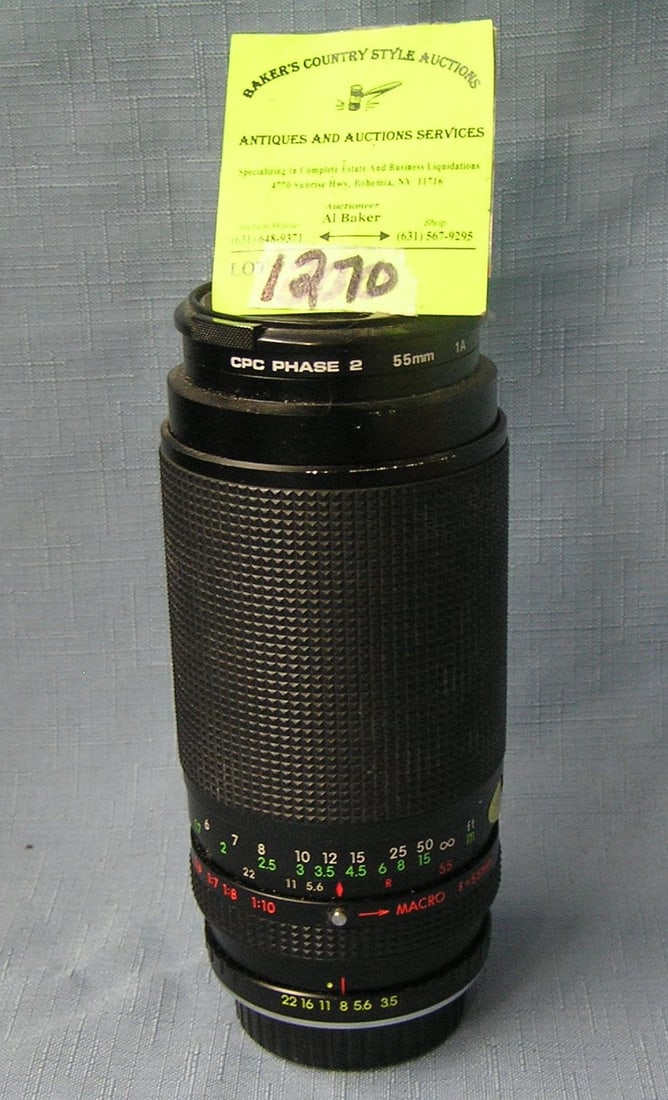 Vintage macro zoom lens: Vintage macro 55 mm zoom lens est. value $75.00-$100.00
