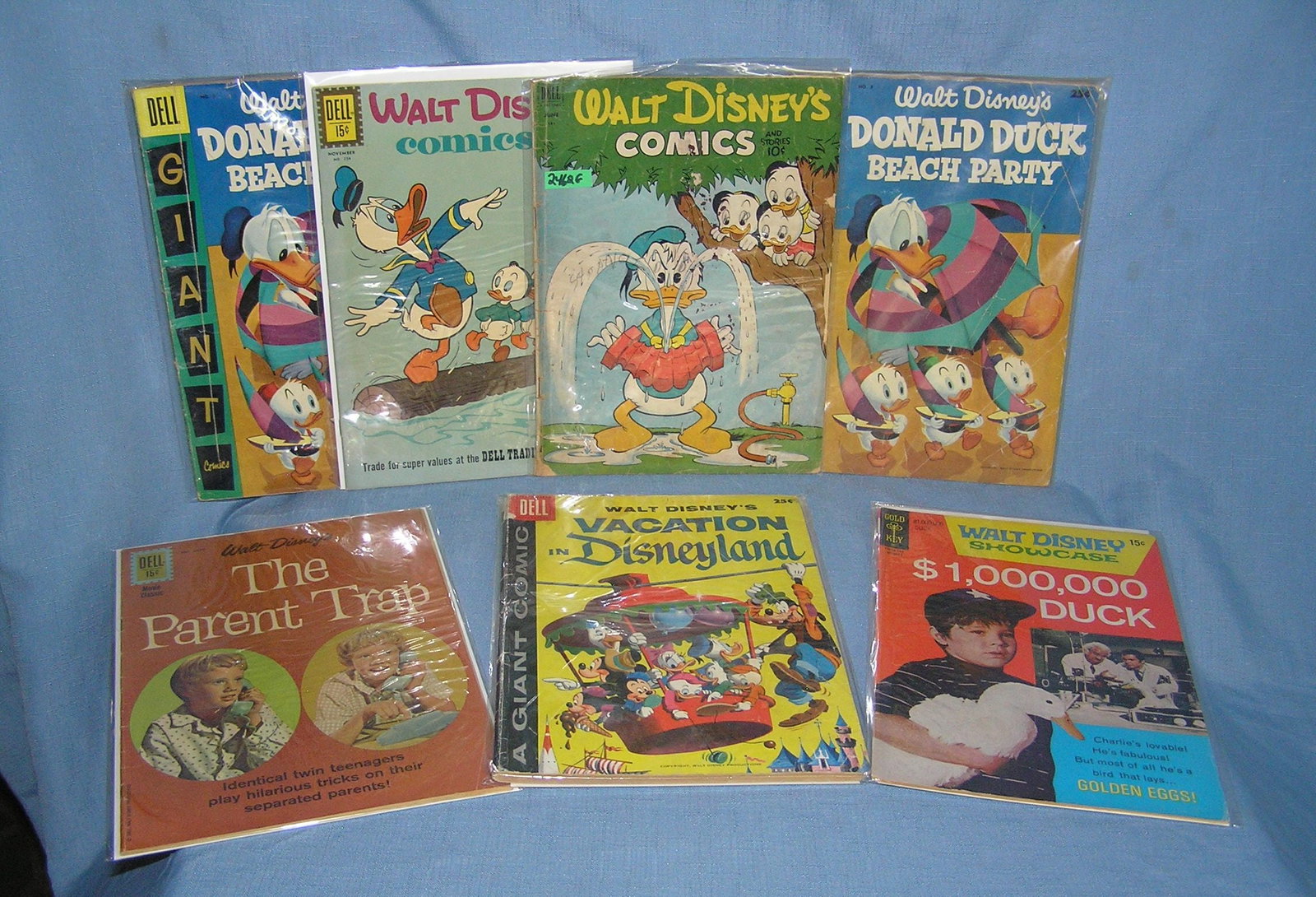 Collection of early Disney comic books: Collection of early Disney comic books with a first edition of Disney Land est. value $125.00-$150.00