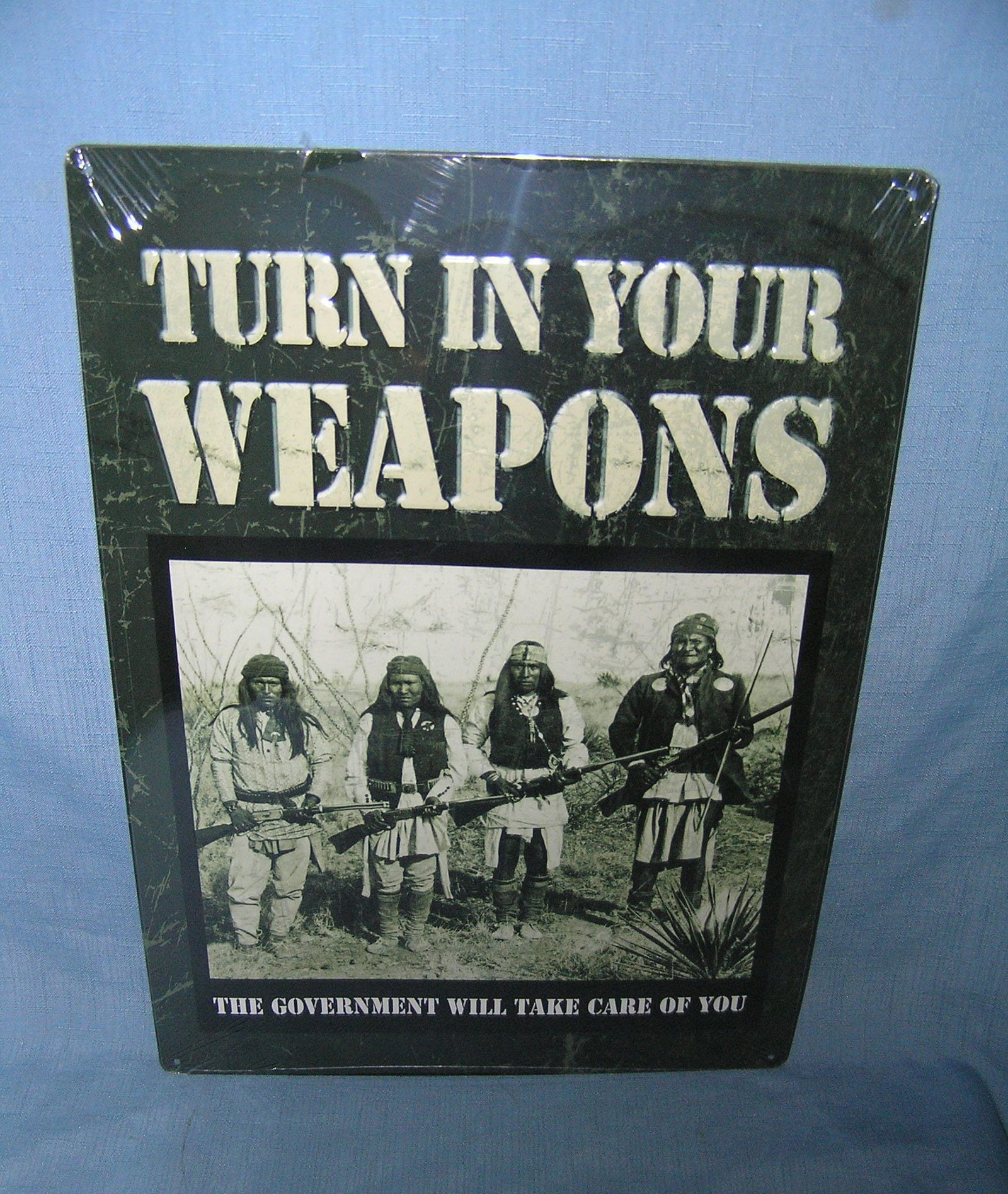 Turn in your weapons all tin advertising sign: Turn in your weapons the government will take care of you all tin advertising sign est.value $50.00-$60.00