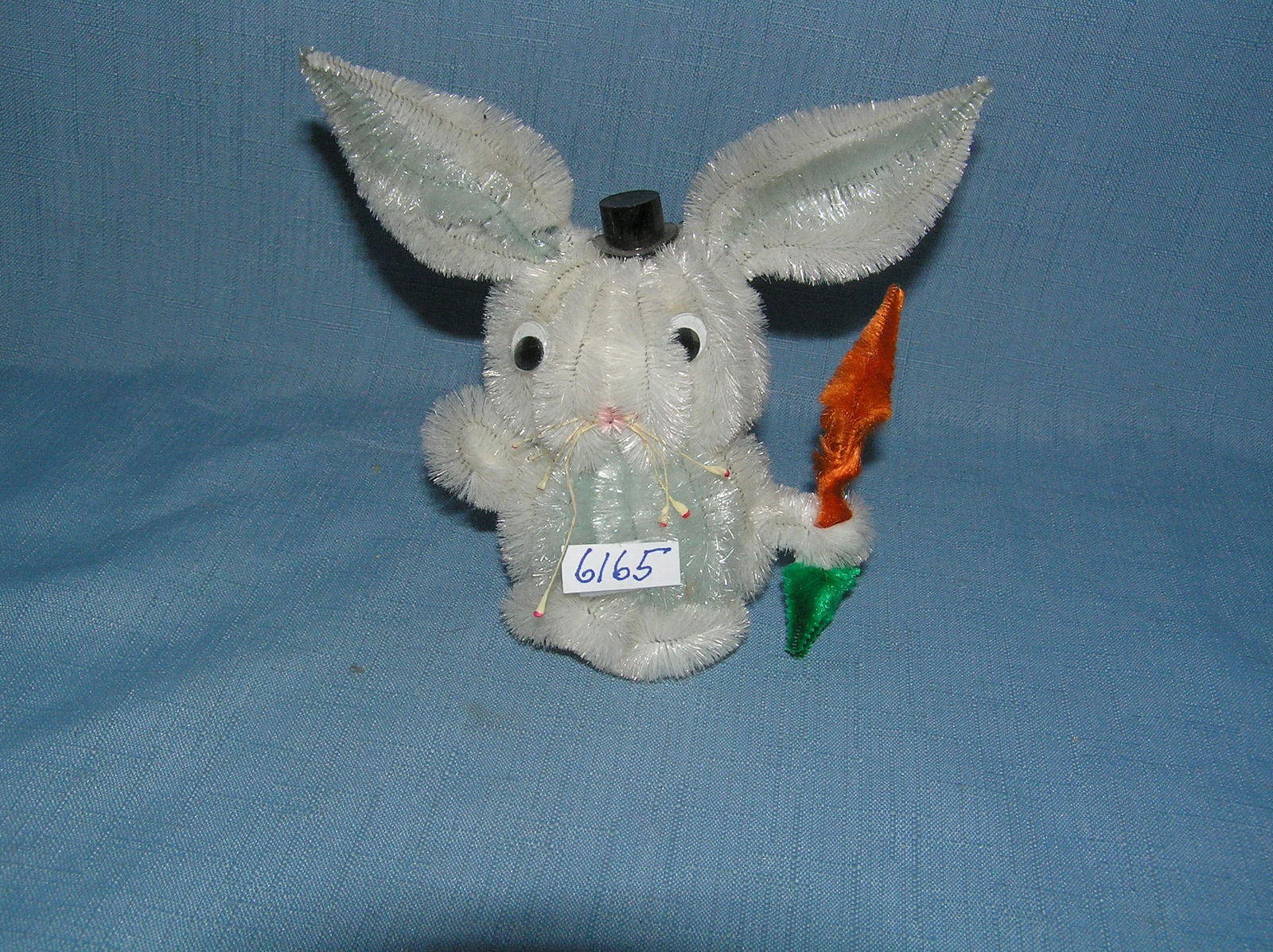 Early pipe cleaner made rabbit holding carrot: Early pipe cleaner made rabbit holding carrot toy with top hat est. value $25.00-$30.00