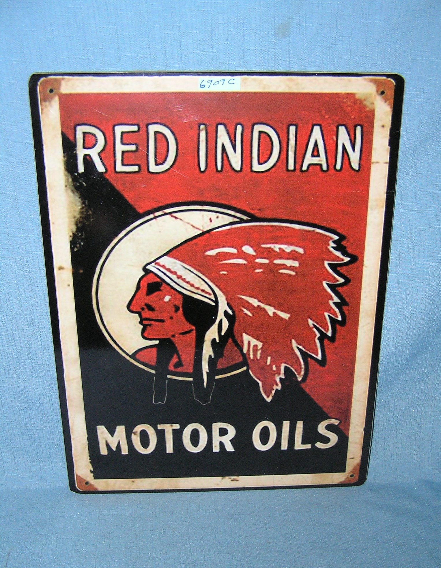 Red Indian motor oil retro style advertising sign: Red Indian motor oil retro style advertising sign printed on PVC hardboard these signs are auctioned for their decorative and display purposes 12 inches by 16 inches est. value $40.00-$50.00