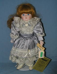 Vintage porcelain doll: Vintage 14 inch porcelain doll est. value $40.00-$50.00
