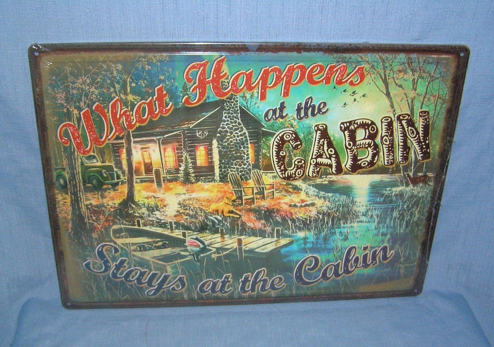 What happens at the cabin stays at the cabin all tin advertising sign (1 of 1)
