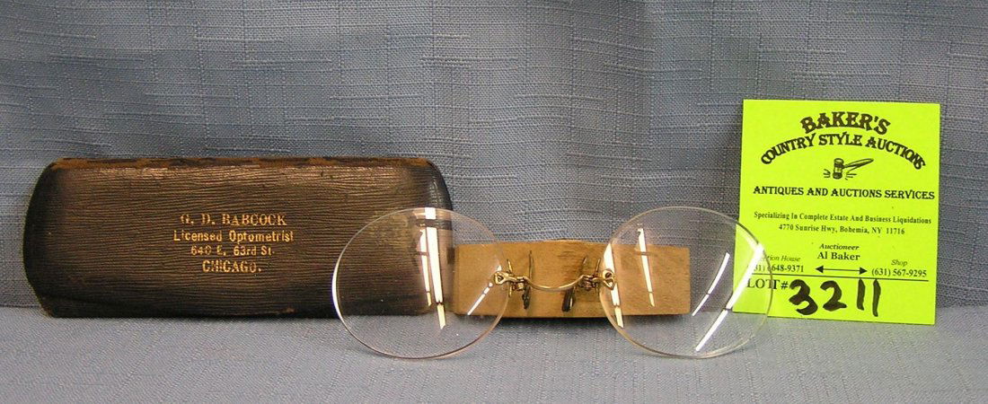 Pair of high quality reading glasses: Pair of high quality reading glasses with gold plated trim in period felt case $65.00-$75.00