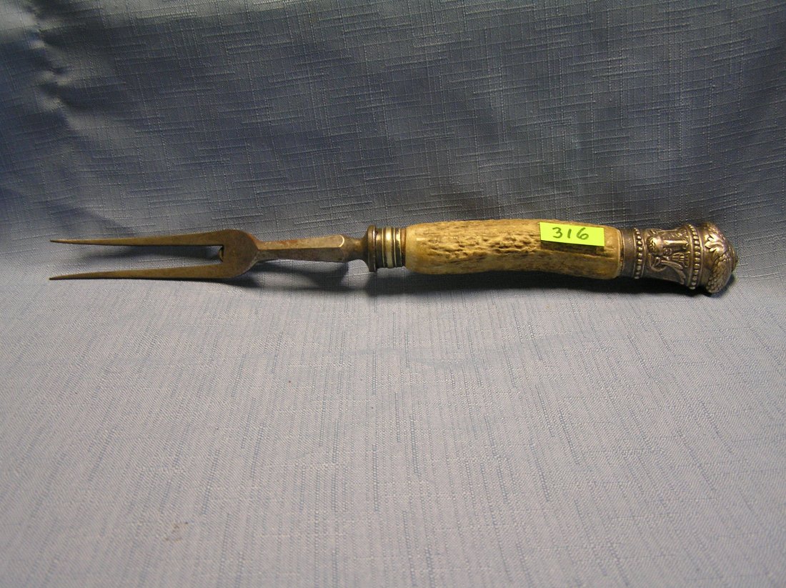 Bone handled and sterling silver carving fork: Bone handled and sterling silver carving fork $75.00-$100.00