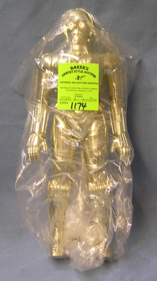 C3P0 Star Wars action figure: Early original 12’’ C3P0 Star Wars action figure with original weapon mint un-played with $150.00-$200.00