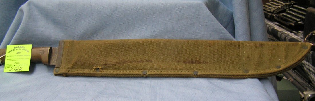 Vintage WII US soldiers machete and sheath dated: Vintage WII US soldiers machete and sheath dated 1945 est. value $65.00-$75.00