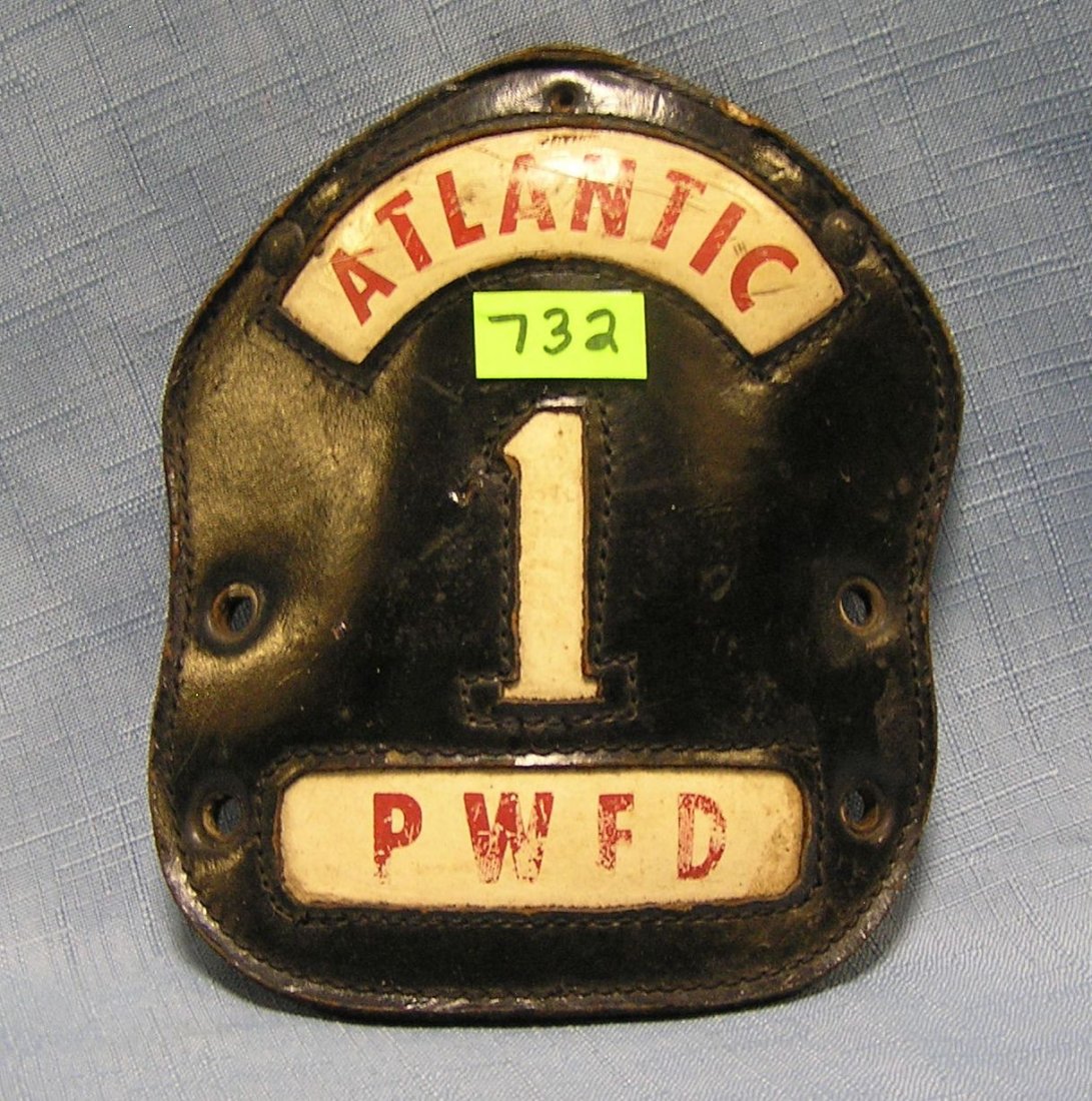 Antique fire helmet shield: Antique fire helmet shield $40.00-$50.00