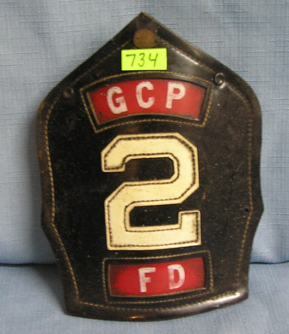Antique fire helmet shield: Antique fire helmet shield $40.00-$50.00