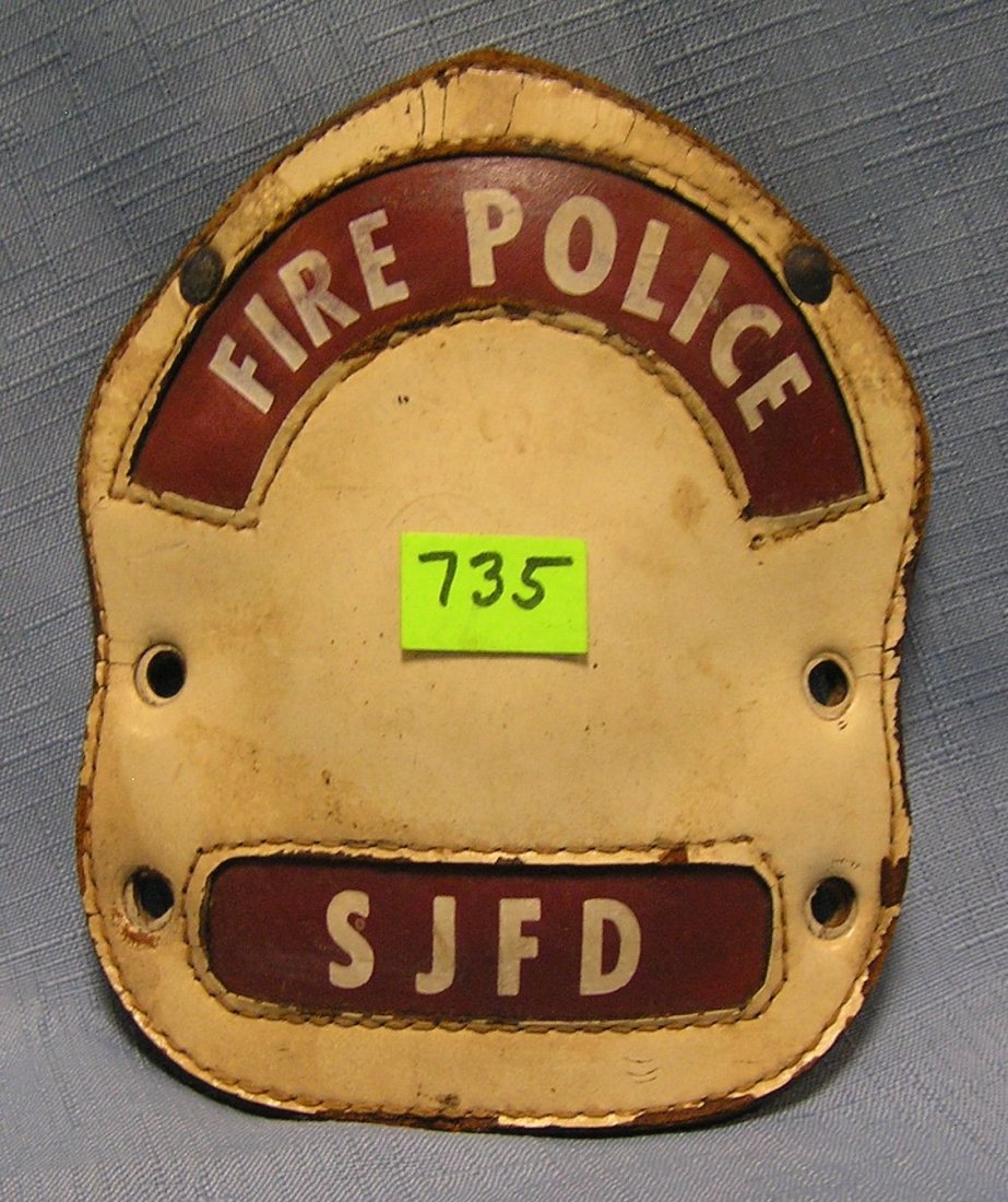 Antique fire helmet shield: Antique fire helmet shield $40.00-$50.00