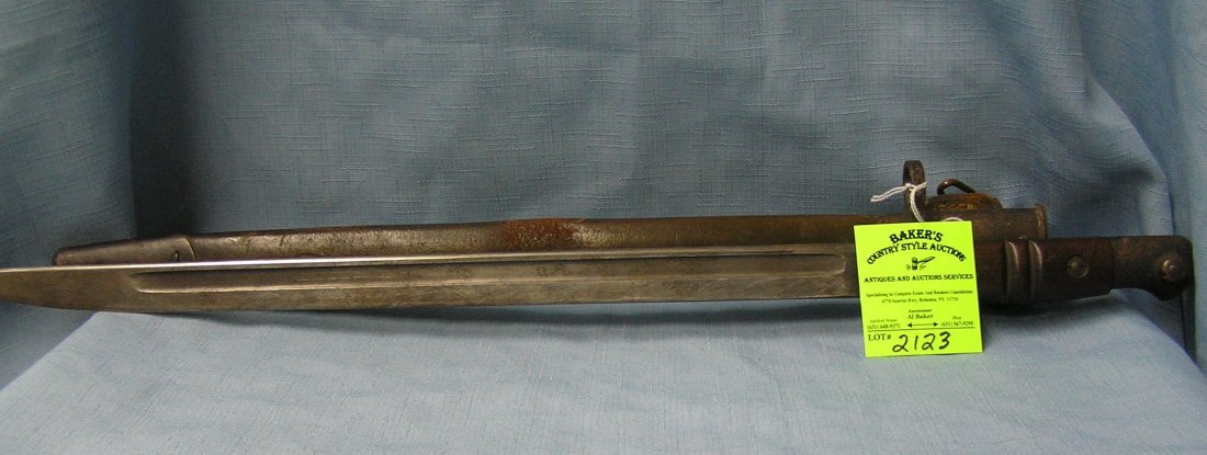 Early WWI US soldiers fighting bayonet dated with: Early WWI US soldiers fighting bayonet dated 1913 with original leather scabbard, note: handle has two notches representing two kills est. value $150.00-$200.00