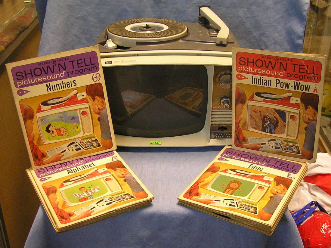 G.E. Show & Tell radio, phonograph & viewer system: General Electric Show and Tell radio, phonograph and viewer system comes complete with 9 Show and Tell picture record sets circa 1964 est. value $125.00-$150.00