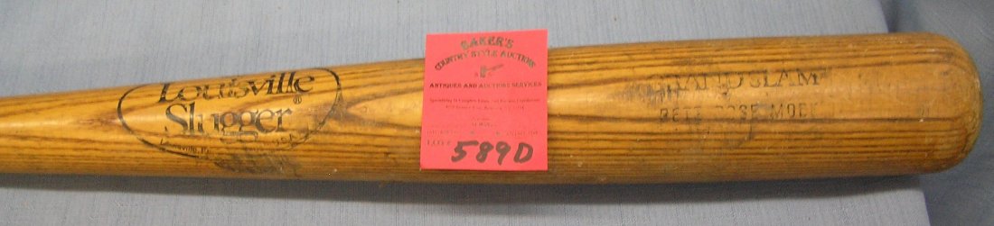 Early Pete Rose grand slam model baseball bat: Early Pete Rose grand slam model baseball bat by Louisville Slugger, 2 inch chip near handle otherwise OK est. value $50.00-$60.00