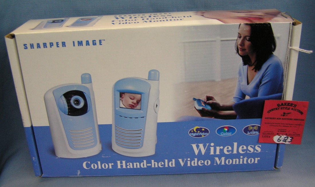 Pair of sharper image color handheld video monitors: Pair of sharper image color handheld video monitors in original box est. value $75.00-$100.00