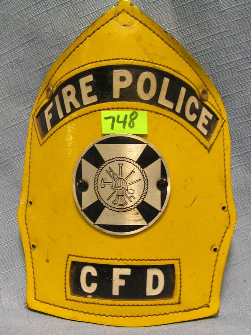Antique fire helmet shield: Antique fire helmet shield est. value $40.00-$50.00