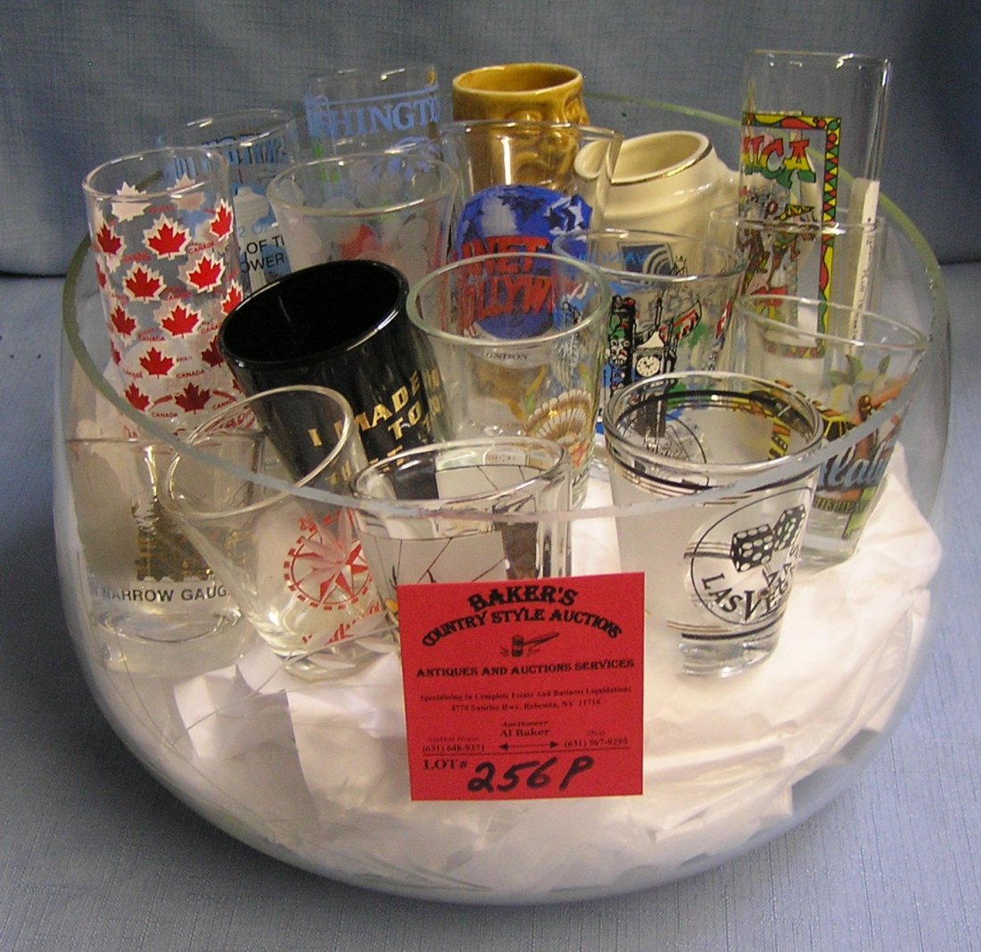Large glass bowl full of vintage shot glasses: Large glass bowl full of vintage shot glasses est. value $30.00-$40.00
