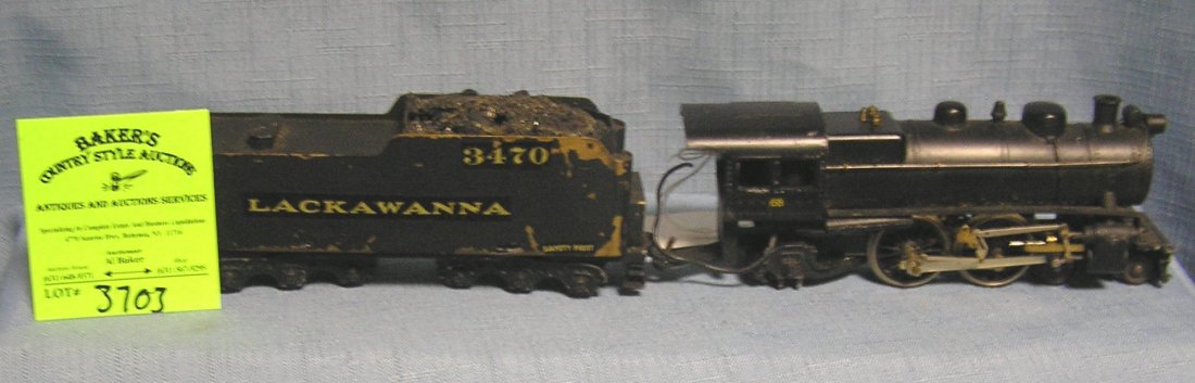 Vintage cast metal engine and coal tender: Vintage cast metal engine and coal tender est. value $150.00-$200.00