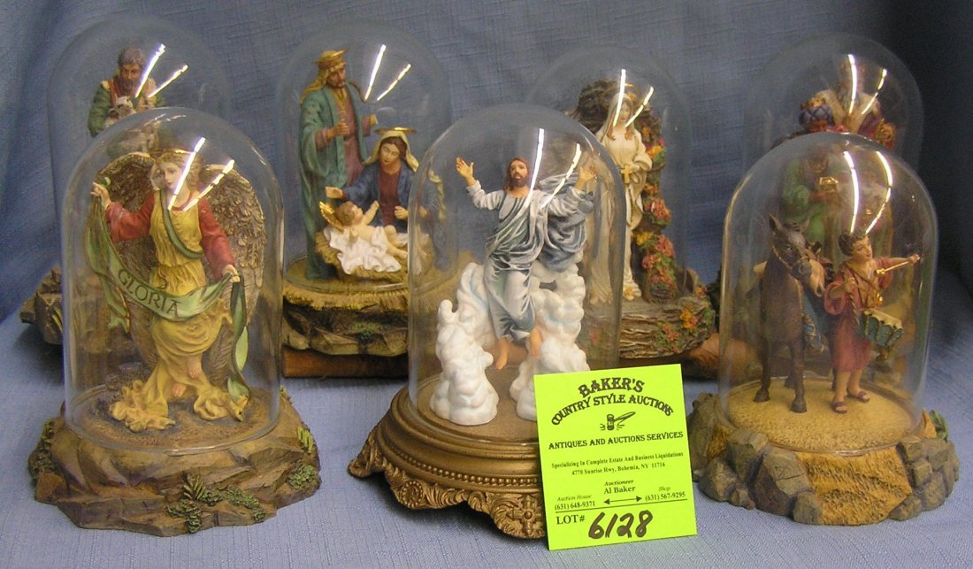 Holiday figurines in glass domed cases by artist Gianio: Group of seven hand painted limited edition Holiday figurines in glass domed cases by artist Gianio Benvenuti $75.00-$100.00