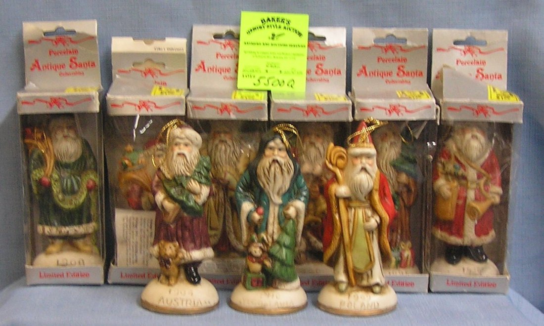 Antique style porcelain figural Santa Claus ornaments: Group of nine antique style porcelain figural Santa Claus ornaments most with original boxes $100.00-$125.00