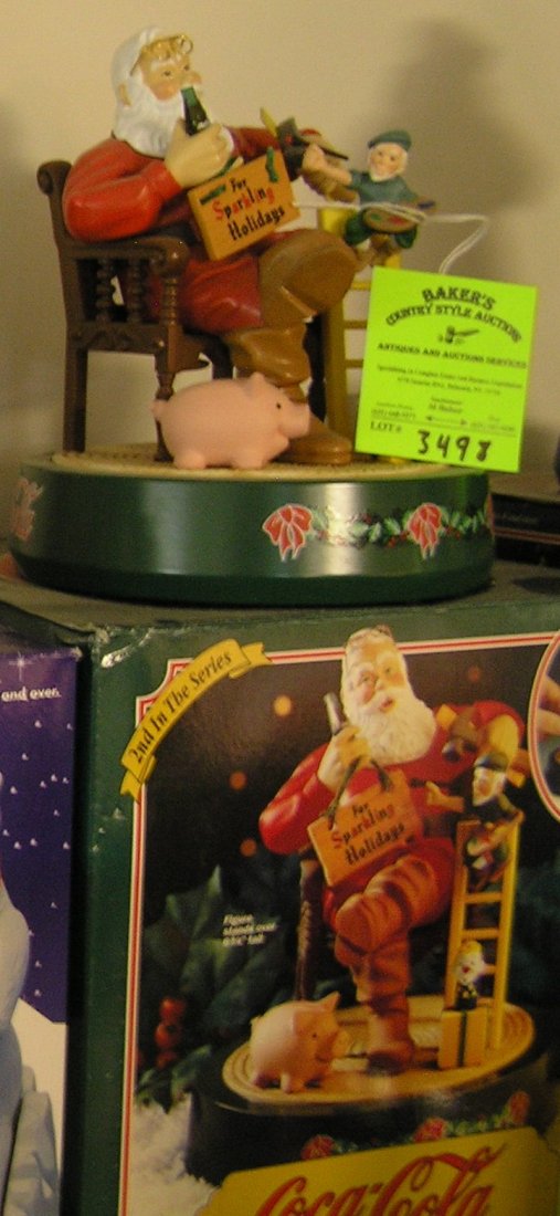 Vintage Coca Cola Santa Claus mechanical bank: Vintage Coca Cola mechanical Santa Claus mechanical bank with original box second in the series est. value $125.00-$150.00