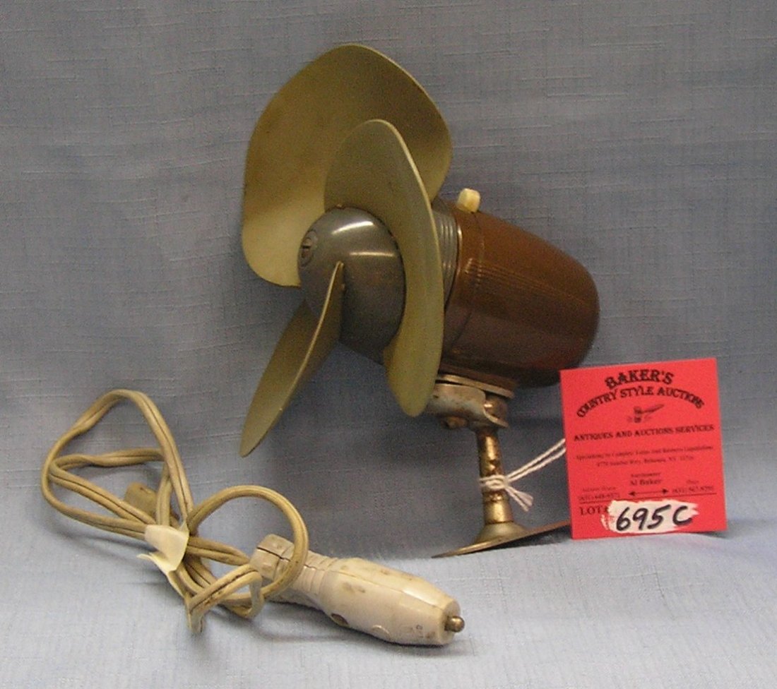 Antique automotive fan: Antique automotive fan works through your 12 volt cigarette lighter made of vintage bakelite with rubber blades circa 1930's est valuve $50.00-$60.00