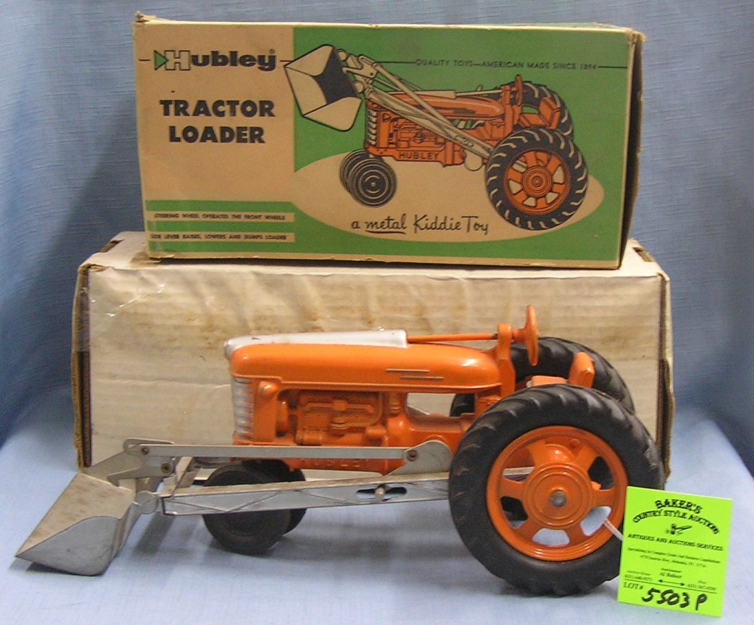 Early all cast metal Hubley tractor with bucket loader: Early all cast metal Hubley tractor with bucket loader circa 1950s with original box est value $ 225.00- $250.00