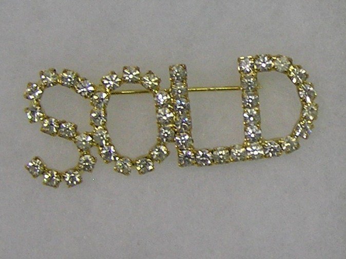 Vintage “SOLD” pin with marcasite stone on gold plated: Vintage “SOLD” pin with marcasite stone on gold plated base est. value $25.00-$35.00