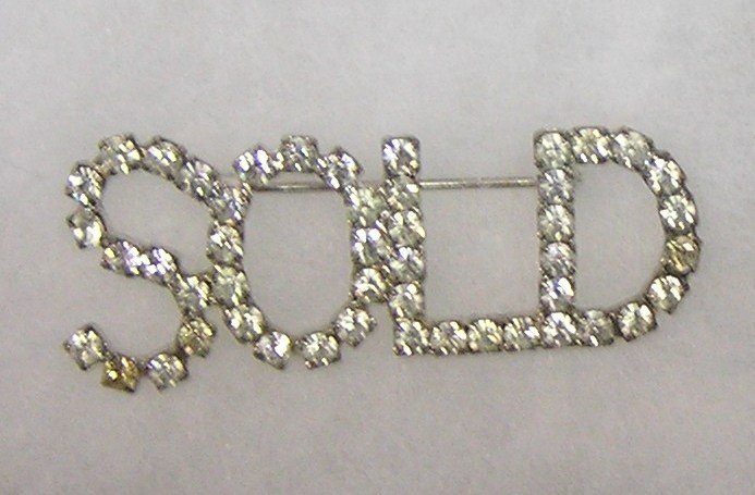 Vintage “SOLD” pin with marcasite stone on silver: Vintage “SOLD” pin with marcasite stone on silver plated base est. value $25.00-$35.00